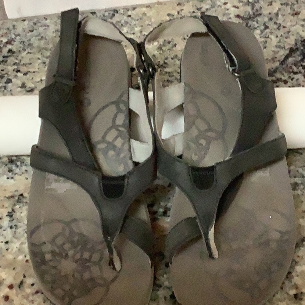 Black leather size 8 Merrell sandals.  Great sole for walking or hiking .
